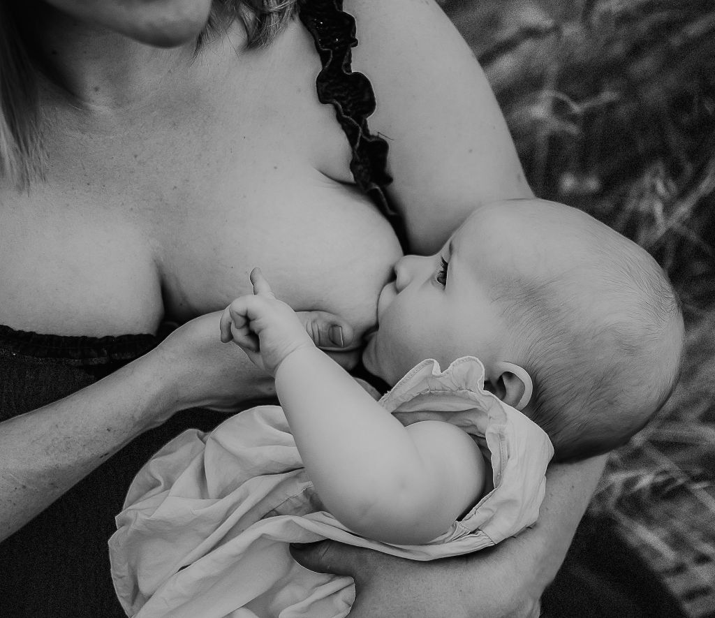 black and white photo of mama nursing baby daughter 
Sacramento and Placer County photographer